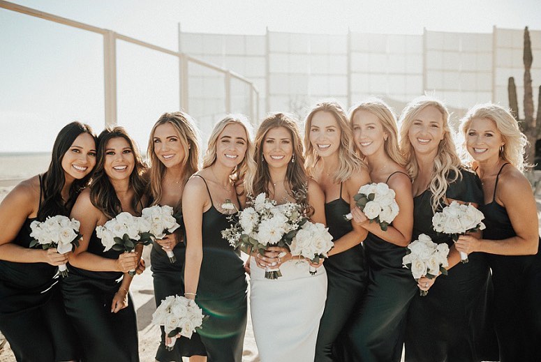 bride and bridesmaids with white bouquets
