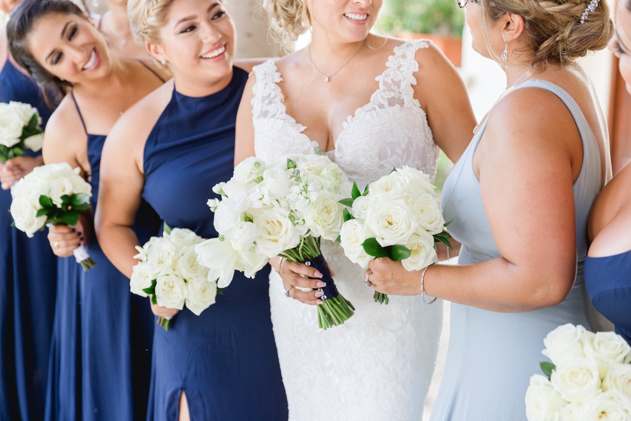 bride and bridesmaids with white bouquets