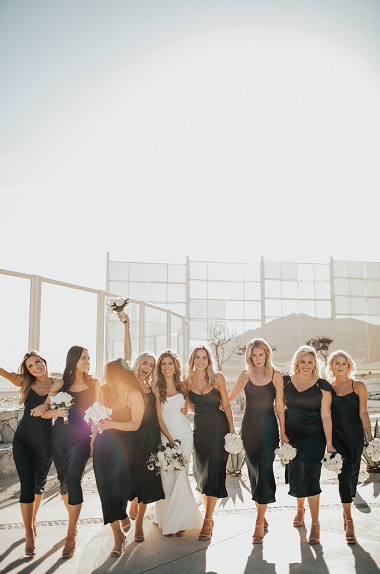 bride and bridesmaids in short black dresses