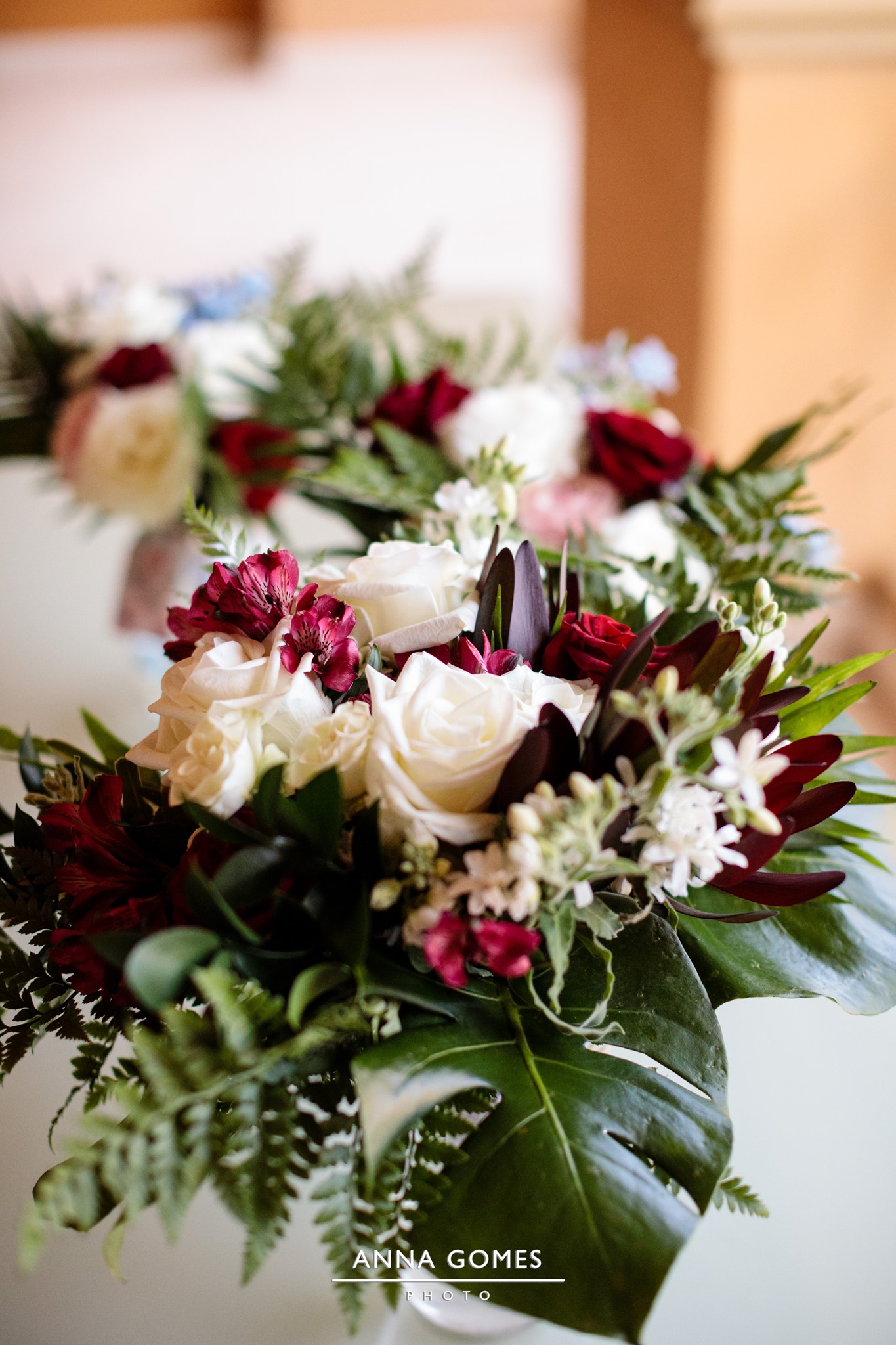 white and burgundy floral arrangement