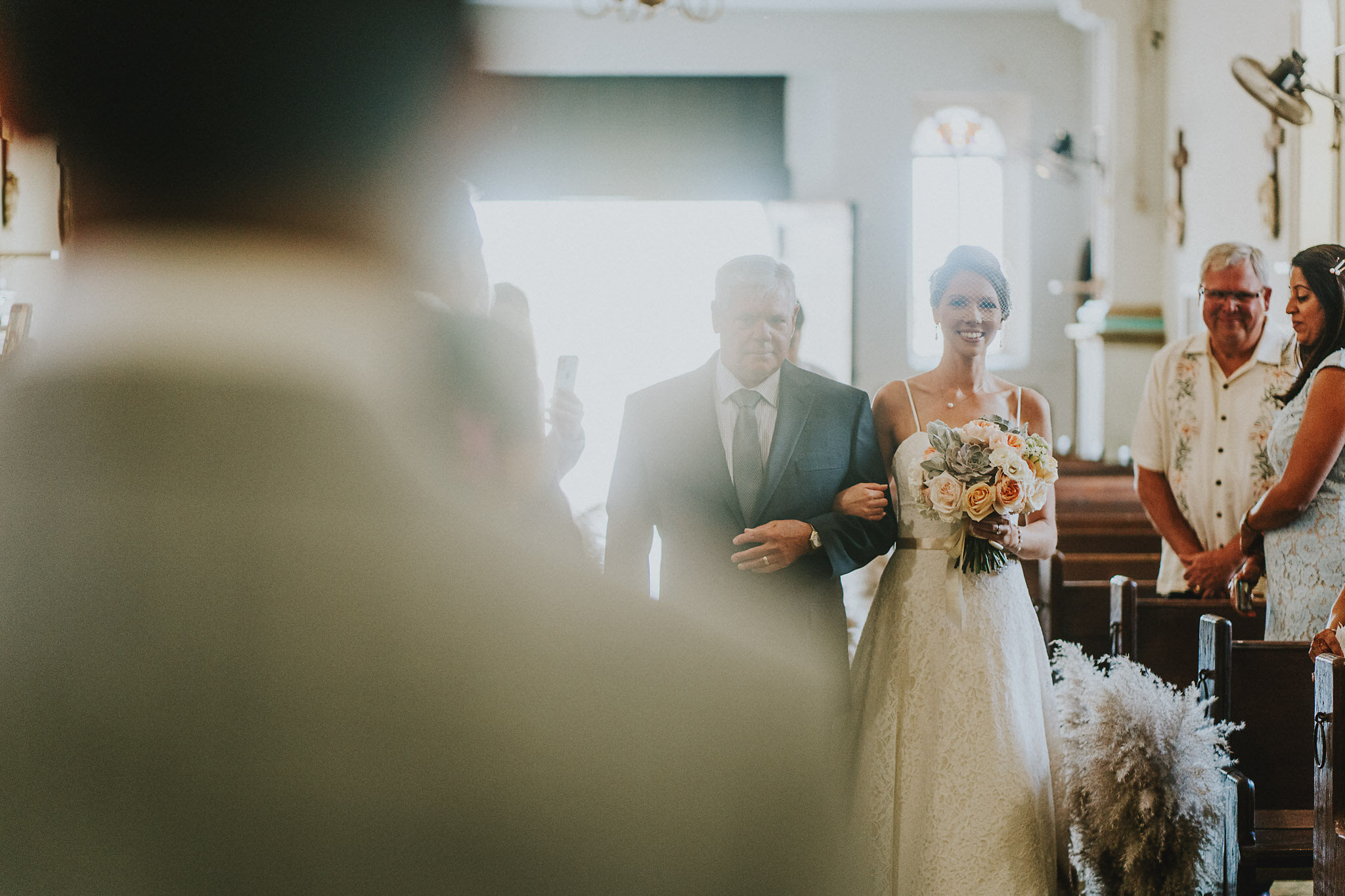 father walking bride down aisle