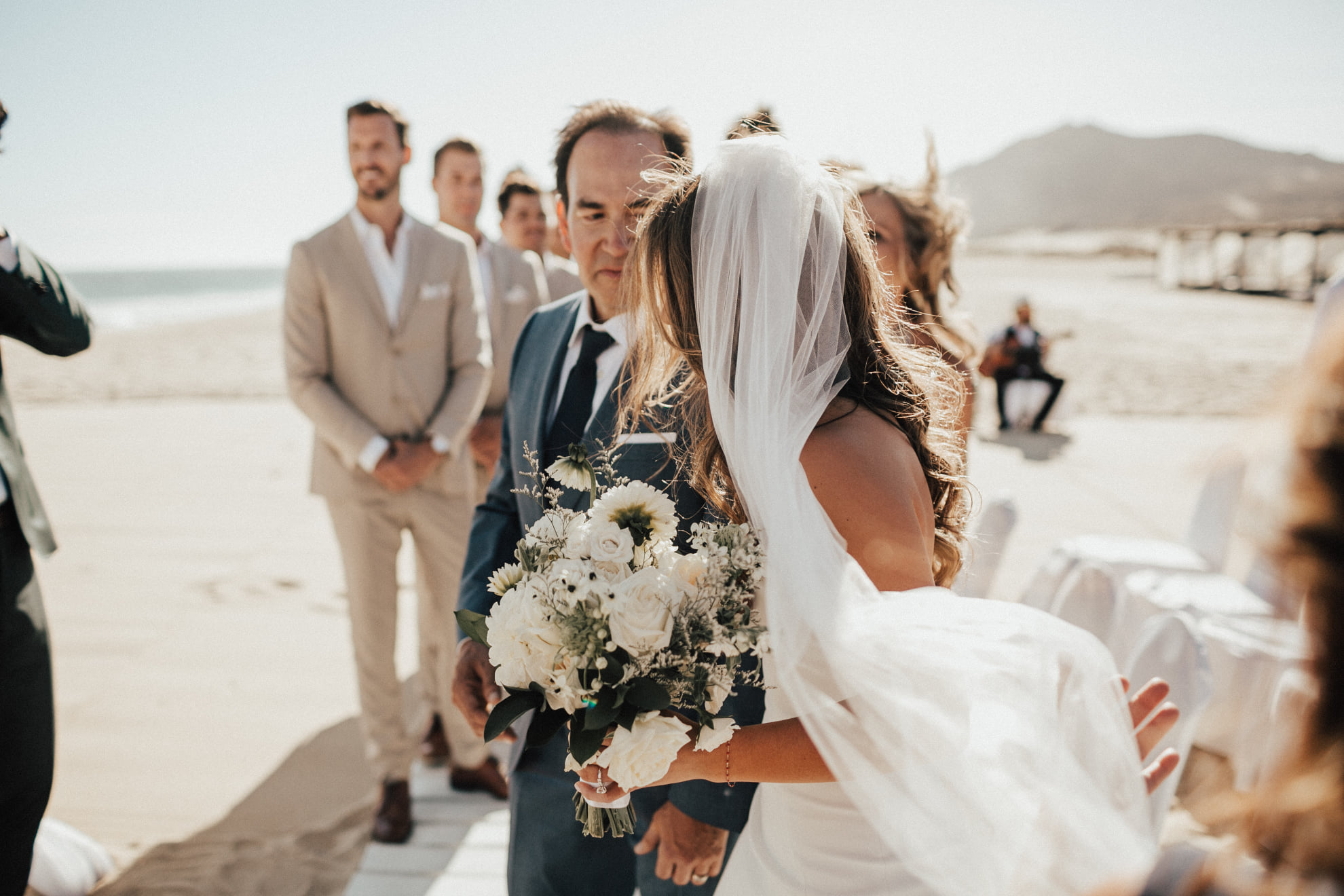 father giving away bride at altar