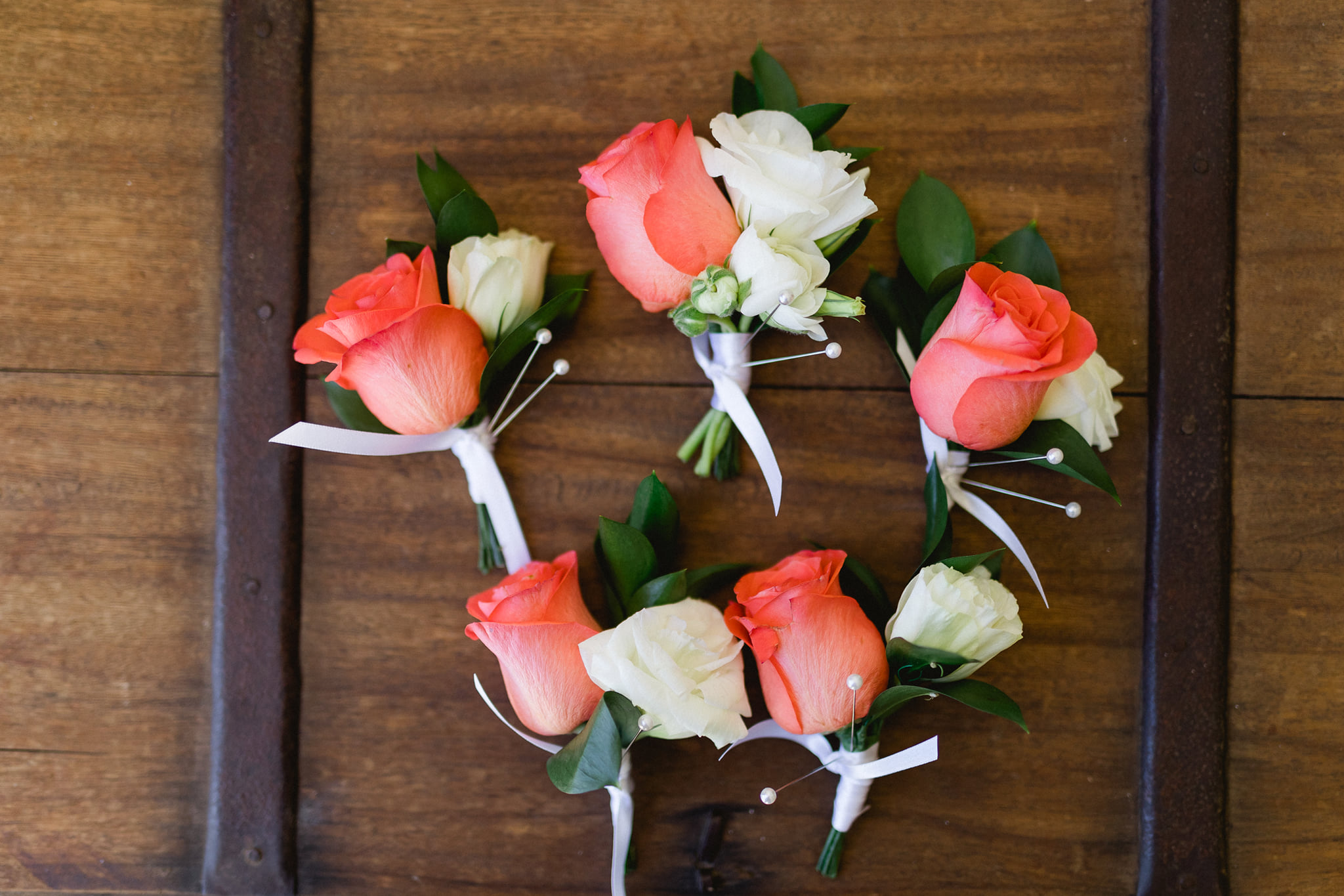 pink and white rose boutonnieres