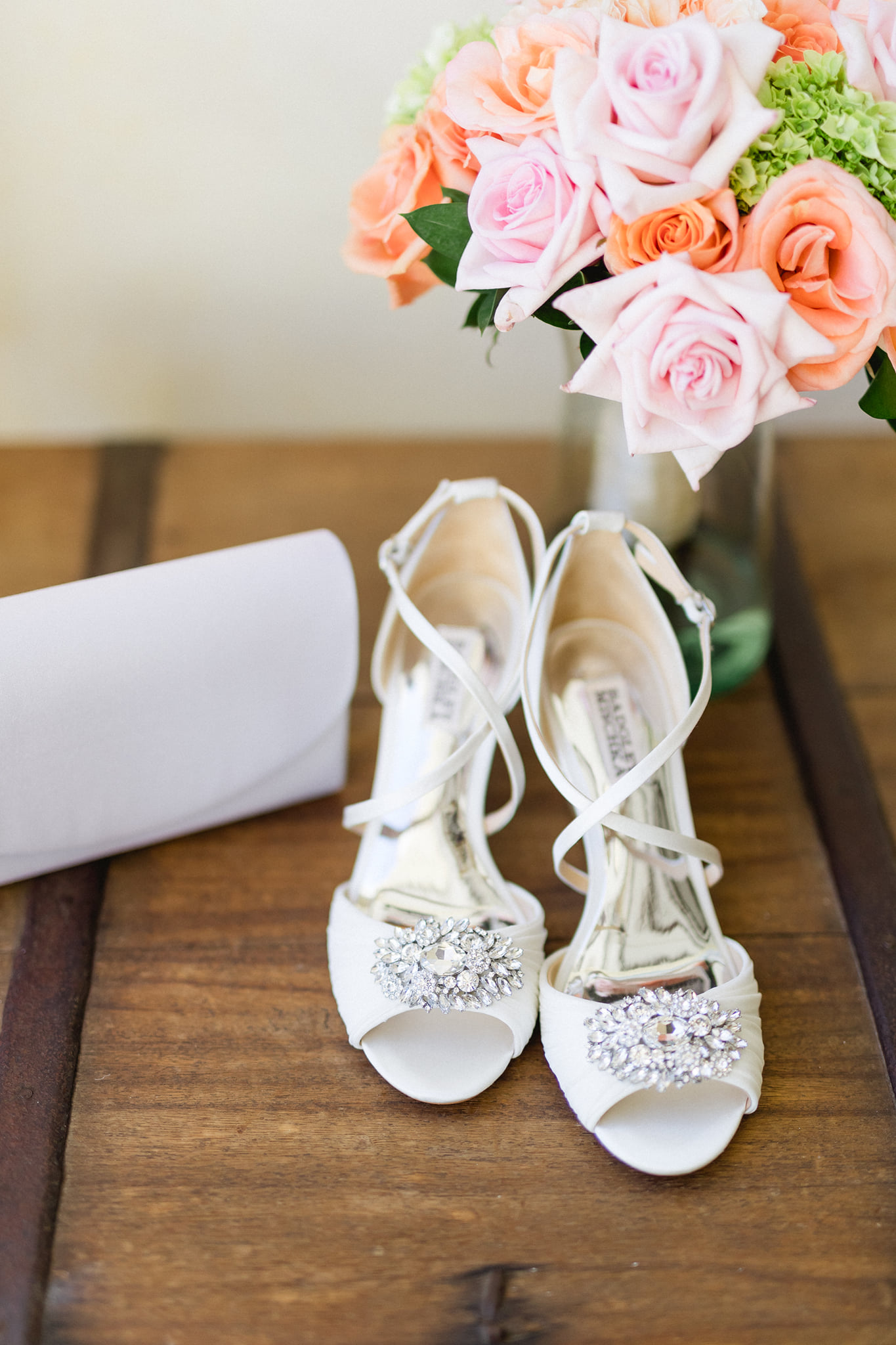 white wedding heels with pink and orange rose bouquet